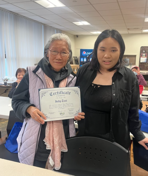 Resident pictured with her Cantonese language instructor.